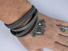 Faux leather and crustal wrap cuff