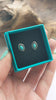 Video showcasing the Southwestern silver and Turquoise stud earrings. This picture shows both available styles: circular silver with a diamond piece of turquoise displayed on a black background AND marquise shape silver with a marquise piece of Turqoise on a back background.  These studs are handmade authentic Native American jewelry. 