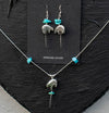 A picture showcasing the dangling bear earrings and their matching necklace also featured on this online shop. 