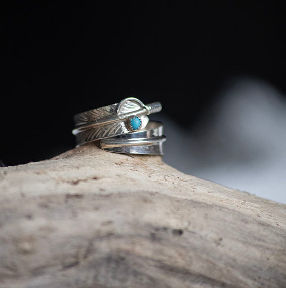 Handcrafted silver wide (but lightweight) feather wrap ring design featuring a Turquoise bead . Beautiful handmade Native American design