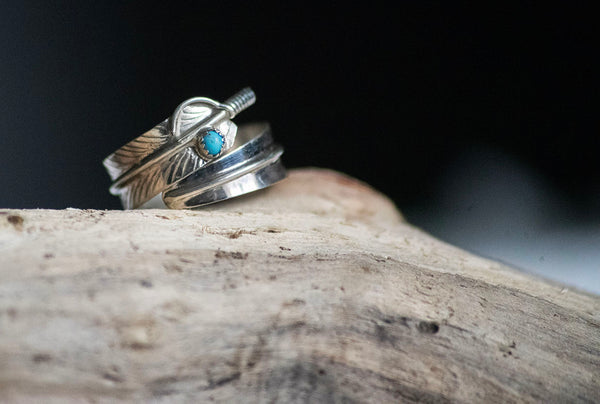 Handcrafted silver wide (but lightweight) feather wrap ring design featuring a Turquoise bead . Beautiful handmade Native American design